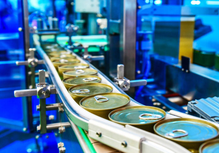 Canned,Food,Products,On,Conveyor,Belt,In,Distribution,Warehouse.parcels,Transportation
