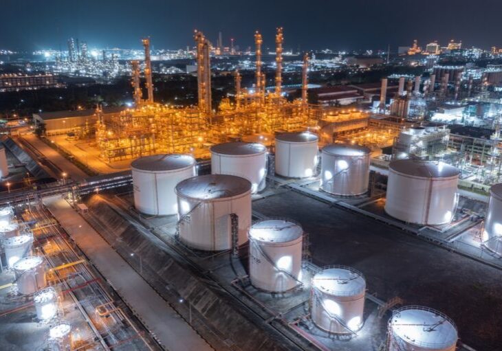 Glowing,Storage,Tanks,And,A,Labyrinth,Of,Pipes,Define,An